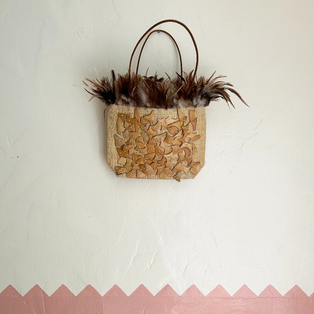 Handmade rattan, shell and feather purse